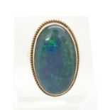 A 9ct gold ring set with an opal triplet within a rope twist border, 6.2g, size L