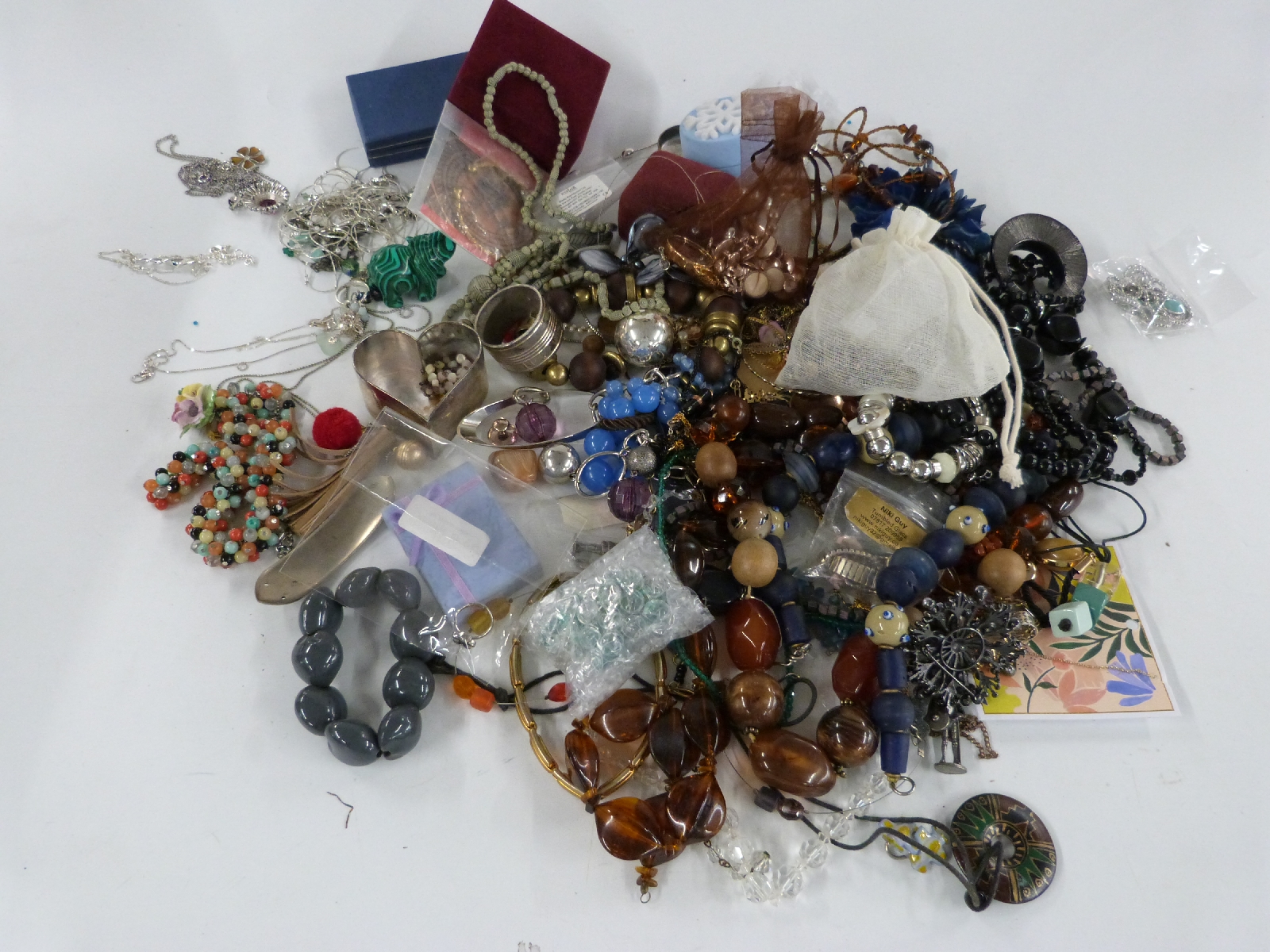 A collection of costume jewellery including necklaces, brooches etc