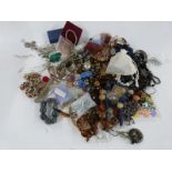 A collection of costume jewellery including necklaces, brooches etc