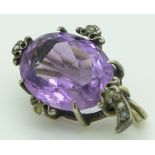 A silver brooch set with an oval cut amethyst and seed pearls, 3 x 2.2cm