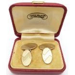 A pair of 9ct gold cufflinks with engine turned decoration, 5.6g