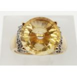A 9ct gold ring set with citrine and diamonds, 5.7g, size J