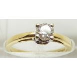 An 18ct gold ring set with a round brilliant cut diamond measuring approximately 0.3ct with
