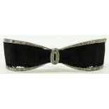 Belle Epoque bow brooch set with diamonds and black ribbon, 5.4cm long