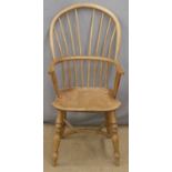 A 19thC elm seated stick back Windsor chair with pierced back splat and crinoline stretcher, 89cm