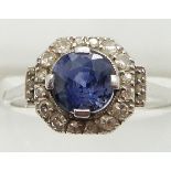 Art Deco platinum ring set with a round cut sapphire measuring approximately 1.8ct surrounded by