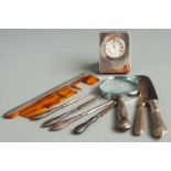 Quantity of hallmarked silver mounted items to include small clock, magnifying glass, comb, knives