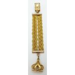 A yellow metal Albert/fob with woven strand and swing fob