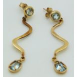 A pair of 9ct gold earrings set with a round and pear cut aquamarines, 4.3g