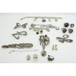 A collection of silver and marcasite jewellery including bracelet, brooches, rings, and two silver