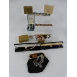 A collection of costume jewellery including watches, marcasite and enamel brooch, cameo, crystal