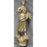 Gilt metal figure of a lady carrying corn, height 57cm