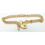 A 9ct gold curb link bracelet with heart padlock, 17.8g