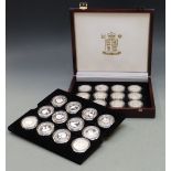 Royal Mint deluxe wooden case containing twenty four Queen Mother silver crown sized coins in
