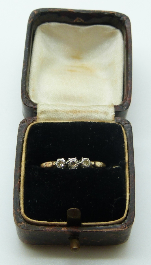 A yellow metal ring set with three diamonds, in original box, size N, 1.9g - Image 2 of 3