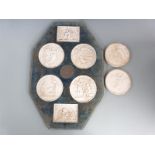A display of six Bing Grondahl Eneret parian type plaques with central bronzed medallion, overall