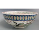 A 19th/20thC Chinese pedestal bowl decorated with peacocks amongst prunus blossom, with six