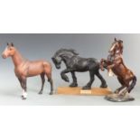 Three Beswick horses including black Spirit of Earth, The Winner and rearing horse, tallest 27cm