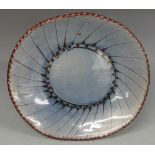 A collection of Studio pottery including large dish with tadpole pattern together with French