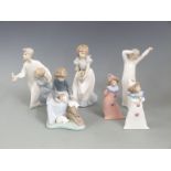 Six Nao child figures including two clowns, girl with rabbits etc, tallest 22cm