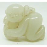 Chinese 19thC jade model of a boy grasping peaches, 3.5 x 3cm