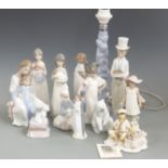 A quantity of Lladro/Nao figures including a figural lamp, tallest 32cm