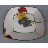 Janice Tchalenko pottery pedestal charger with yellow, red and green decoration