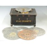 Atlas-organette musical box with six interchangeable 22.5cm ployphon style discs, overall width
