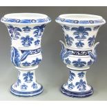 A pair of blue and white campana pedestal urns with 'India Jane, London' to base, H48cm