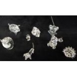 A collection of nine Swarovski animals including hedgehog, owl, mouse etc