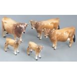 A collection of Beswick Jersey cattle, tallest 12cm