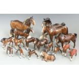 Approximately 16 Beswick brown horses and foals