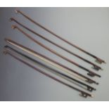 Six round stick violin bows, various button types including bone, ebony, four with plain frogs