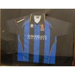 Cheltenham Town and Cambridge United signed football shirt in display frame, titled 'won on Saturday