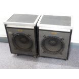 A pair of Goodmans speakers mounted in reinforced travel cases on castors, speaker cone diameter
