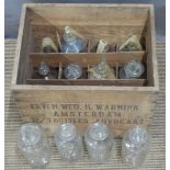 Twelve fluid/chemical jar/bottles in Erven Wed. H. Warnink, Amsterdam advocaat case