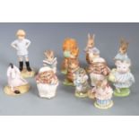 Twelve Beswick, Royal Albert and Royal Doulton figures including Beatrix Potter, Winnie the Pooh