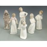 Seven Nao child figures including girl with candle, tallest 29cm