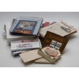 A box of sundries including presentation packs, packs of spare album sheets, Isle of Man books and
