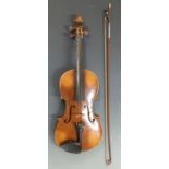 A late 19thC violin labelled Maggini Deutsche Urbeit 1886, the table with double purfling, the two-