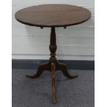 19thC oak tilt top table raised on a tripod base, diameter 63cm