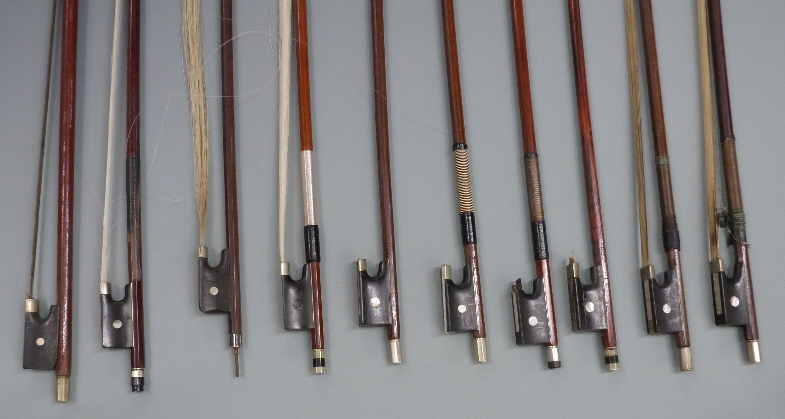 Ten round stick violin bows with various button types, plain eyes to frogs - Image 2 of 4