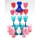 Seventeen cranberry and green drinking glasses together with a Bristol Blue glass vase, 14.5cm tall