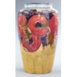 Moorcroft vase decorated in the Pomegranate pattern with eight pomegranates including four open,