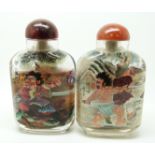 Two Japanese reverse painted glass scent bottles depicting Samurai warriors, with agate stoppers,