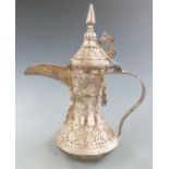 Middle Eastern ewer with raised textured decoration, 29cm tall