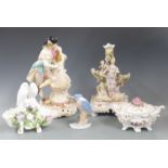 Continental figures including a figural candlestick, Naples bow pot, figural bird salt etc,