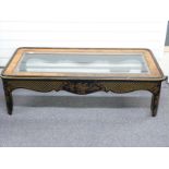 A hardwood and beveled glass topped coffee table with chinoiserie decoration, W143 x D77 x H41cm