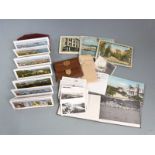 A collection of souvenir postcards and photographs including Barcelona, Montreal, Maine, Niagra