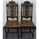 Pair of Victorian oak hall chairs with carved lion decoration